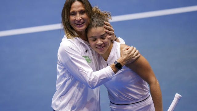 Italy's Jasmine Paolini, right, celebrates with Tathiana Garbin, captain of team Italy, after defeating France's Caroline Garcia during their group stage tennis match between France and Italy on the second day of the Billie Jean King Cup finals at La Cartuja stadium in Seville, southern Spain, Wednesday, Nov. 8, 2023. (AP Photo/Manu Fernandez)