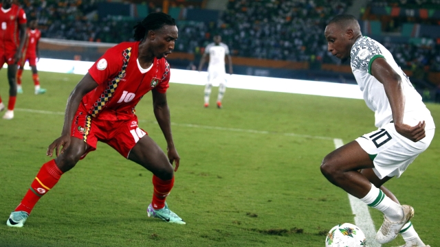 epa11097049 Oyodole Aribo Joseph (R) of Nigeria and Janio Bikel (L) of Guinea-Bissau  in action during the CAF 2023 Africa Cup of Nations match between Nigeria and Bissau Guinea, in Abidjan, Ivory Coast, 22 January 2024.  EPA/LEGNAN KOULA