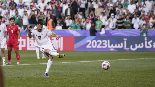 Iraq's Aymen Hussein scores his side's third goal from a penalty spot during the Asian Cup Group D soccer match between Iraq and Vietnam at Jassim Bin Hamad Stadium in Doha, Qatar, Wednesday, Jan. 24, 2024. (AP Photo/Aijaz Rahi)