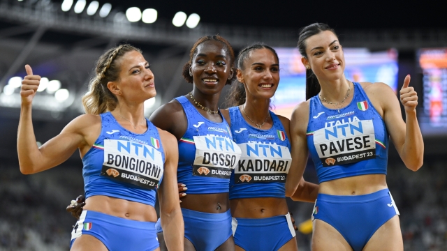 BUDAPEST, HUNGARY - AUGUST 26: Anna Bongiorni, Zaynab Dosso, Dalia Kaddari, and Alessia Pavese of  Team Italy react after the Women's 4x100m Relay Final during day eight of the World Athletics Championships Budapest 2023 at National Athletics Centre on August 26, 2023 in Budapest, Hungary. (Photo by Shaun Botterill/Getty Images)