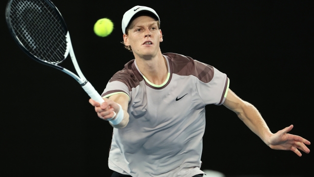 MELBOURNE, AUSTRALIA - JANUARY 28: Jannik Sinner of Italy plays a forehand during their Men's Singles Final match against Daniil Medvedev during the 2024 Australian Open at Melbourne Park on January 28, 2024 in Melbourne, Australia. (Photo by Cameron Spencer/Getty Images)