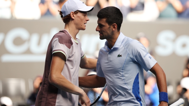 MELBOURNE, AUSTRALIA - JANUARY 26: Jannik Sinner of Italy shakes hands with Novak Djokovic of Serbia in their Semifinal singles match during the 2024 Australian Open at Melbourne Park on January 26, 2024 in Melbourne, Australia. (Photo by Daniel Pockett/Getty Images)