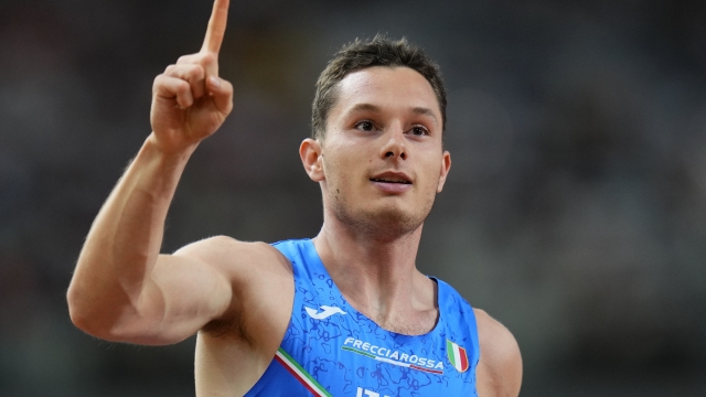 Filippo Tortu, of Italy reacts after anchorong his team to win a Men's 4x100-meters relay heat during the World Athletics Championships in Budapest, Hungary, Friday, Aug. 25, 2023. (AP Photo/Petr David Josek)