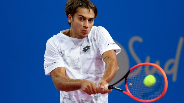 Italy's Flavio Cobolli returns the ball to France's Constant Lestienne during their singles tennis match at the Open Sud de France ATP World Tour in Montpellier, southern France, on February 1, 2024. (Photo by Pascal GUYOT / AFP)