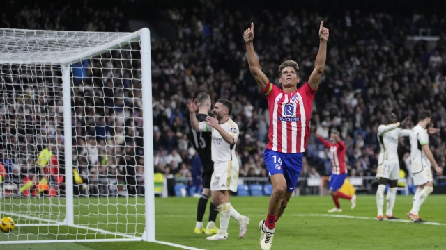 Atletico Madrid's Marcos Llorente celebrates after scoring his side's first goal during the Spanish La Liga soccer match between Real Madrid and Atletico Madrid at the Santiago Bernabeu stadium in Madrid, Spain, Sunday, Feb. 4, 2024. (AP Photo/Bernat Armangue)