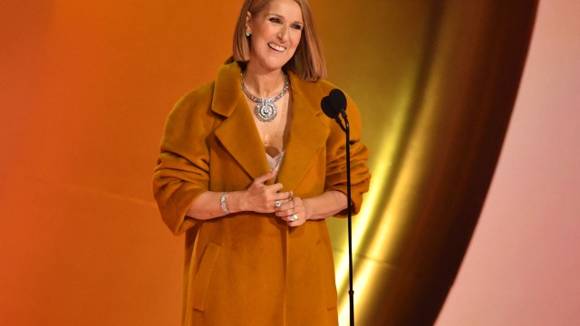 TOPSHOT - Canadian singer Celine Dion presents the Album Of The Year award on stage during the 66th Annual Grammy Awards at the Crypto.com Arena in Los Angeles on February 4, 2024. (Photo by Valerie Macon / AFP)