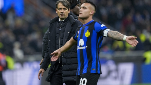 Inter Milan's head coach Simone Inzaghi, left, and Lautaro Martinez celebrate at the end of a Serie A soccer match between Inter Milan and Juventus, in Milan, Italy, Sunday, Feb. 4, 2024. (AP Photo/Antonio Calanni)