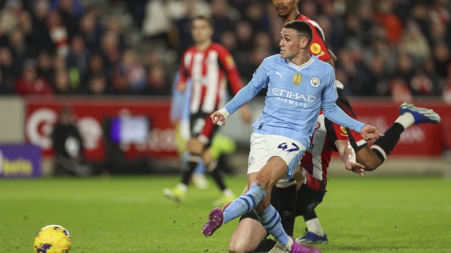 Manchester City's Phil Foden scores his side's third goal during the English Premier League soccer match between Brentford and Manchester City at the Gtech Community Stadium in London, Monday, Feb. 5, 2024. (AP Photo/Ian Walton)