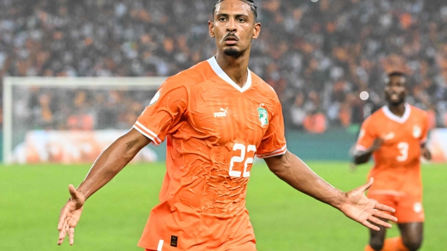 Ivory Coast's forward #22 Sebastien Haller celebrates scoring his team's first goal during the Africa Cup of Nations (CAN) 2024 semi-final football match between Ivory Coast and Democratic Repuplic of Congo at Alassane Ouattara Olympic Stadium in Ebimpe, Abidjan on February 7, 2024. (Photo by Sia KAMBOU / AFP)