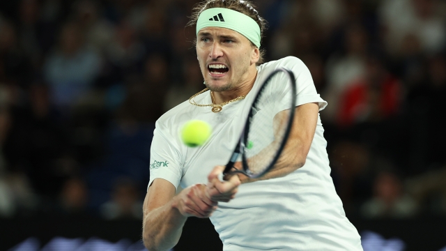 MELBOURNE, AUSTRALIA - JANUARY 26: Alexander Zverev of Germany plays a backhand in their Semifinal singles match against Daniil Medvedev during the 2024 Australian Open at Melbourne Park on January 26, 2024 in Melbourne, Australia. (Photo by Daniel Pockett/Getty Images)