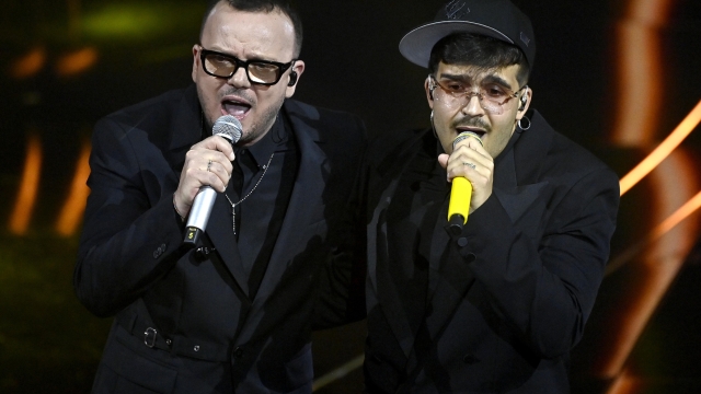 Italian singes Geolier (R) and  Gigi D'Alessio (L) perform on stage at the Ariston theatre during the 74th Sanremo Italian Song Festival in Sanremo, Italy, 09 February 2024. The music festival runs from 06 to 10 February 2024.   ANSA/RICCARDO ANTIMIANI