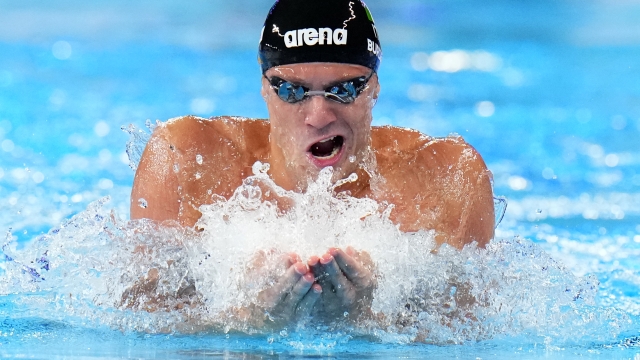 Nicolo Martinenghi of Italy swims in a men's breaststroke 100-meter heat at the World Aquatics Championships in Doha, Qatar, Sunday, Feb. 11, 2024. (AP Photo/Hassan Ammar)