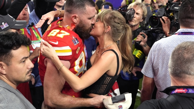 Taylor Swift kisses Kansas City Chiefs tight end Travis Kelce after the NFL Super Bowl 58 football game against the San Francisco 49ers, Sunday, Feb. 11, 2024, in Las Vegas. The Chiefs won 25-22. (AP Photo/John Locher)