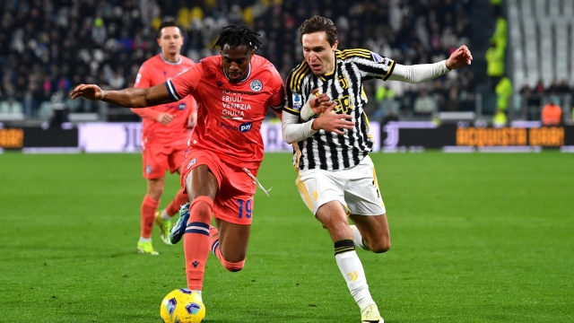 TURIN, ITALY - FEBRUARY 12: Kingsley Ehizibue of Udinese Calcio is challenged by Federico Chiesa of Juventus during the Serie A TIM match between Juventus and Udinese Calcio - Serie A TIM  at  on February 12, 2024 in Turin, Italy. (Photo by Valerio Pennicino/Getty Images)