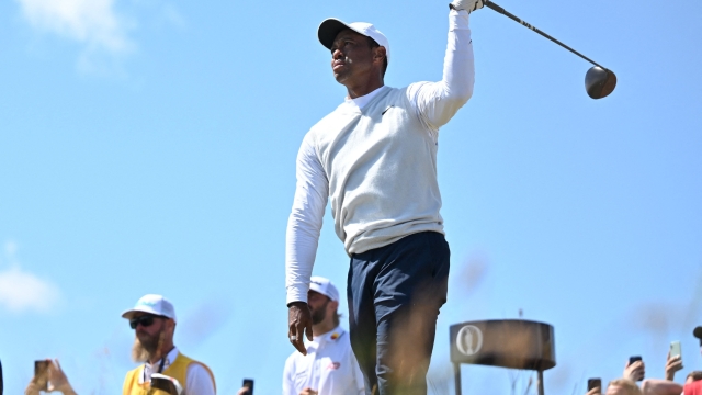 (FILES) US golfer Tiger Woods reacts to his drive from the 14th tee during his second round on day 2 of The 150th British Open Golf Championship on The Old Course at St Andrews in Scotland on July 15, 2022. Tiger Woods announced January 8, 2024 that he was ending a longstanding partnership with Nike, thanking the sports brand in a social media post that alluded to "another" unspecified chapter. (Photo by Glyn KIRK / AFP) / RESTRICTED TO EDITORIAL USE