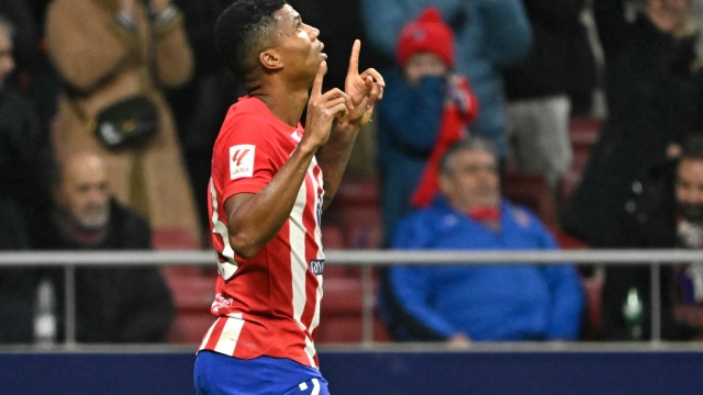 Atletico Madrid's Mozambican defender #23 Reinildo Mandava celebrates scoring the opening goal during the Spanish league football match between Club Atletico de Madrid and Rayo Vallecano de Madrid at the Metropolitano stadium in Madrid on January 31, 2024. (Photo by JAVIER SORIANO / AFP)