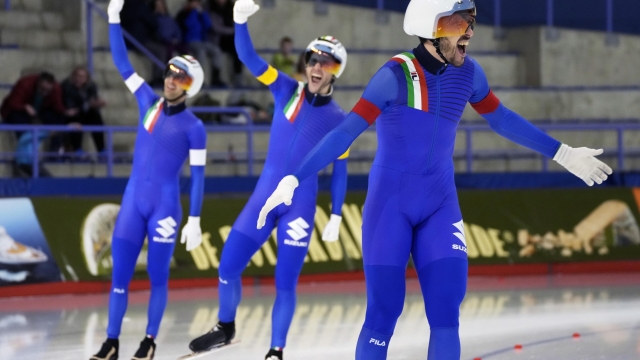 epa11159451 Andrea Giovannini, (L-R) Michele Malfatti and Davide Ghiotto of Italy celebrate after their race in the Menâ??s Team Pursuit event at the ISU World Speed Skating Single Distances Championships in Calgary, Canada, 16 February 2024.  EPA/TODD KOROL