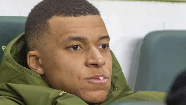 PSG's Kylian Mbappe looks out from the bench before the French League One soccer match between Nantes and Paris Saint-Germain at the Stade de la Beaujoire in Nantes, France, Saturday, Feb. 17, 2024. (AP Photo/Mathieu Pattier)