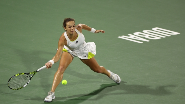 DUBAI, UNITED ARAB EMIRATES - FEBRUARY 19:  Lucia Bronzetti of Italy plays a forehand against Daria Kasatkina in their first round women's singles match  during the Dubai Duty Free Tennis Championships, part of the Hologic WTA Tour at Dubai Duty Free Tennis Stadium on February 19, 2024 in Dubai, United Arab Emirates. (Photo by Francois Nel/Getty Images)