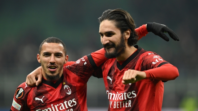 MILAN, ITALY - FEBRUARY 15:  Yacine Adli of AC Milan celebrates the win with Ismael Bennacer at the end of the UEFA Europa League 2023/24 Playoff First Leg match between AC Milan and Stade Rennais FC at Stadio Giuseppe Meazza on February 15, 2024 in Milan, Italy. (Photo by Claudio Villa/AC Milan via Getty Images)