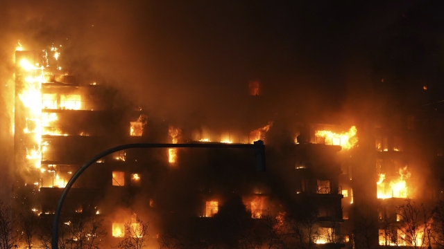 A housing block burns in Valencia, Spain, Thursday, Feb. 22, 2024. The cause of the fire is unknown and if there are any victims. (AP Photo/Alberto Saiz)