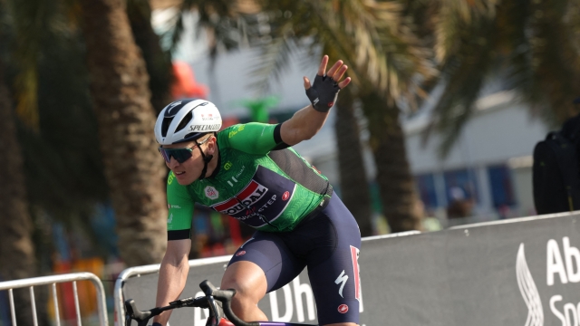 Soudal QuickStep's Belgian cyclist Tim Merlier gestures as he wins stage 6 of the 6th UAE Cycling Tour from the Louvre Abu Dhabi to Abu Dhabi Breakwater on February 24, 2024. (Photo by Giuseppe CACACE / AFP)