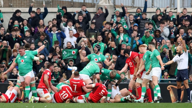 Ireland players celebrate the opening try by Ireland's hooker Dan Sheehan during the Six Nations international rugby union match between Ireland and Wales at the Aviva Stadium in Dublin, on February 24, 2024. (Photo by Paul Faith / AFP)