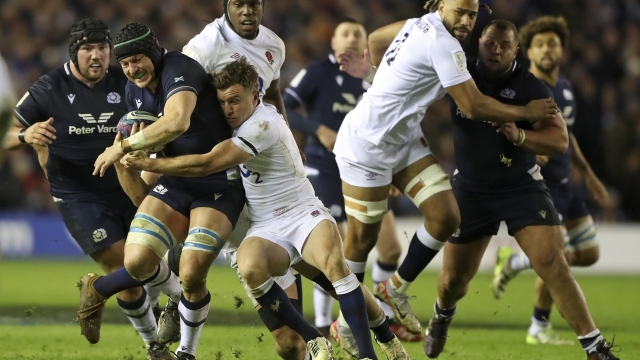 England's George Ford tackles Scotland's Jack Dempsey during the Six Nations rugby union International between Scotland and England at Murrayfield stadium in Edinburgh, Saturday, Feb. 24, 2024. (AP Photo/Scott Heppell)