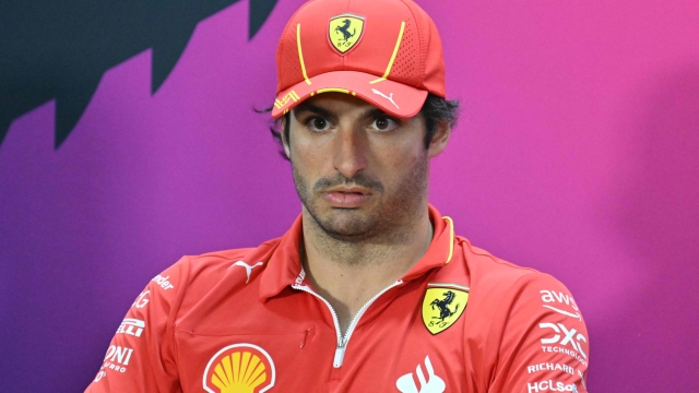 Ferrari's Spanish driver Carlos Sainz Jr attends a press conference during the first day of the Formula One pre-season testing at the Bahrain International Circuit in Sakhir on February 21, 2024. (Photo by Andrej ISAKOVIC / AFP)