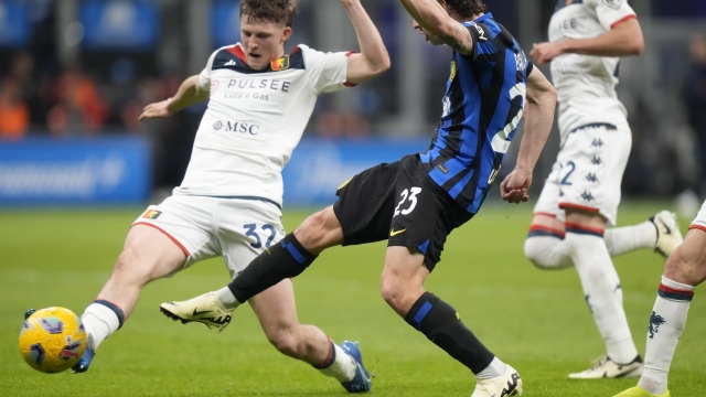 Inter Milan's Nicolo Barella, right, and Genoa's Morten Frendrup, left, fight for the ball during a Serie A soccer match between Inter Milan and Genoa at the San Siro stadium in Milan, Italy, Monday, March 4, 2024. (AP Photo/Luca Bruno)