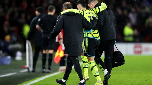 SHEFFIELD, ENGLAND - MARCH 04: Gabriel Martinelli of Arsenal is helped off the pitch by medical staff after an injury during the Premier League match between Sheffield United and Arsenal FC at Bramall Lane on March 04, 2024 in Sheffield, England. (Photo by David Rogers/Getty Images)