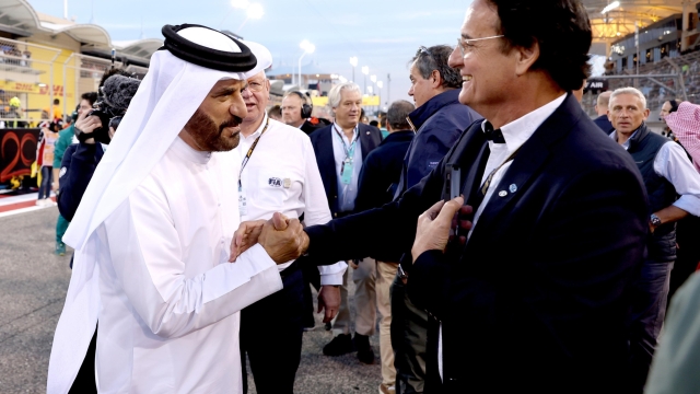 epa11194152 FIA president Mohammed Ben Sulayem (L) greets guests on the grid before the start of the Formula One Bahrain Grand Prix, at Bahrain International Circuit in Sakhir, Bahrain, 02 March 2024.  EPA/ALI HAIDER