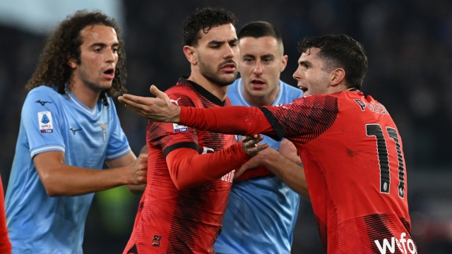 ROME, ITALY - MARCH 01: Theo Hernandez and Christian Pulisic of AC Milan has a heated discussion with Matteo Guendouzi of SS Lazio during the Serie A TIM match between SS Lazio and AC Milan - Serie A TIM  at Stadio Olimpico on March 01, 2024 in Rome, Italy. (Photo by Claudio Villa/AC Milan via Getty Images)