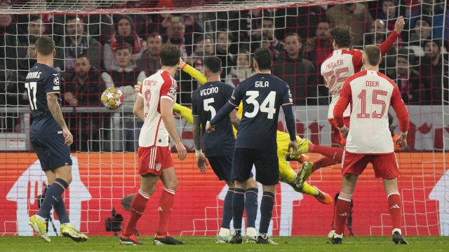 Bayern's Thomas Mueller, second right, scores his side's second goal during the Champions League round of 16 second leg soccer match between FC Bayern Munich and Lazio at the Allianz Arena stadium in Munich, Germany, Tuesday, March 5, 2024. (AP Photo/Matthias Schrader)