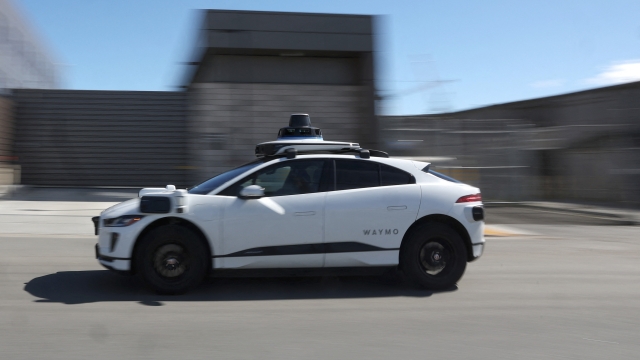 SAN FRANCISCO, CALIFORNIA - MARCH 01: A Waymo car drives along a street on March 01, 2023 in San Francisco, California. Waymo, Alphabet's self-driving car division, announced that it has laid off over 135 employees in a second round of layoffs this year. Waymo has cut 8 percent of its workforce this year.   Justin Sullivan/Getty Images/AFP (Photo by JUSTIN SULLIVAN / GETTY IMAGES NORTH AMERICA / Getty Images via AFP)