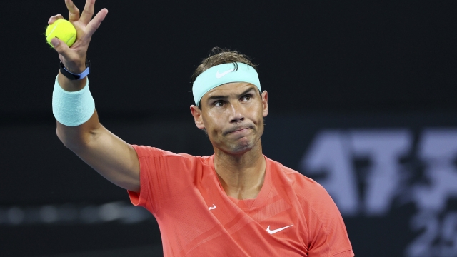 FILE - Rafael Nadal of Spain waves to the crowd in his match against Dominic Thiem of Austria during the Brisbane International tennis tournament in Brisbane, Australia, Tuesday, Jan. 2, 2024. Rafael Nadal pulled out of the BNP Paribas Open on Wednesday night, March 6, 2024, a day before he was supposed to play his first official match in two months. Nadal, a 22-time Grand Slam champion, posted the news on social media, writing that he was announcing the withdrawal ?with great sadness.? (AP Photo/Tertius Pickard, File)