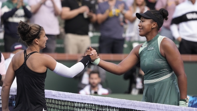 Naomi Osaka, of Japan, right, shakes hands with Sara Errani, of Italy, after defeating her at the BNP Paribas Open tennis tournament, Thursday, March 7, 2024, in Indian Wells, Calif. (AP Photo/Mark J. Terrill)