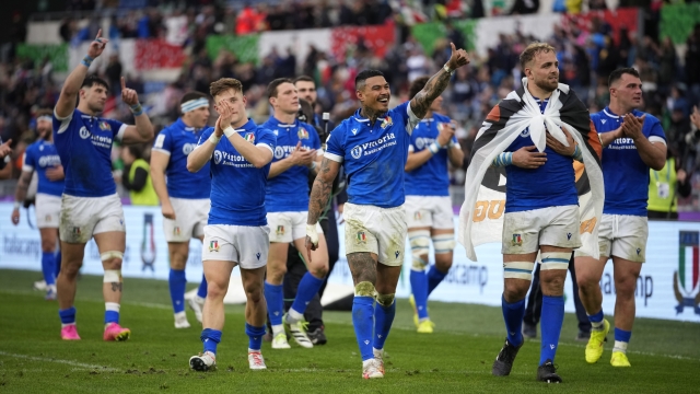 Italy's players celebrate at the end of the Six Nations rugby union international match between Italy and Scotland, at Rome's Olympic Stadium, Saturday, March 9, 2024. Italy beat Scotland by 31-29. (AP Photo/Andrew Medichini)