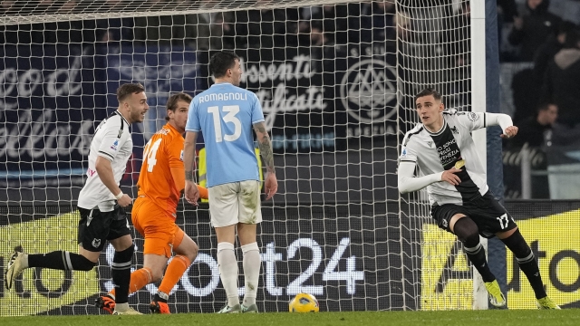 Udinese's Lorenzo Lucca celebrates after scoring his side's first goal during a Serie A soccer match between Lazio and Udinese, at Rome's Olympic Stadium, Monday, March 11, 2024. (AP Photo/Andrew Medichini)