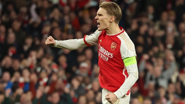 epa11217521 Martin Odegaard of Arsenal celebrates after scoring the first penalty in the shoot-out of the UEFA Champions League Round of 16, 2nd leg match between Arsenal and Porto in London, Britain, 12 March 2024.  EPA/NEIL HALL