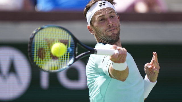 Casper Ruud, of Norway, returns to Gael Monfils, of France, at the BNP Paribas Open tennis tournament, Wednesday, March 13, 2024, in Indian Wells, Calif. (AP Photo/Mark J. Terrill)