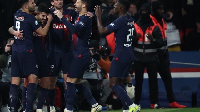 Saint-Germain's Brazilian midfielder #35 Lucas Beraldo (2L) celebrates with his teammates after scoring his team third goal during the French Cup (Coupe de France) quarter-final football match between Paris Saint-Germain (PSG) and OGC Nice at the Parc des Princes stadium, in Paris, on March 13, 2024. (Photo by FRANCK FIFE / AFP)