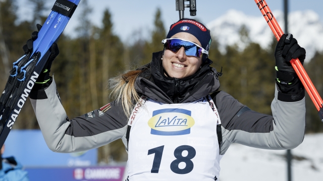 Italy's Lisa Vittozzi celebrates winning the World Cup biathlon women's 7.5 km sprint event in Canmore, Alberta, Thursday, March 14, 2024. (Jeff McIntosh/The Canadian Press via AP)