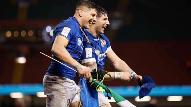 epa11224363 Ignacio Brex (L) and Tommaso Menoncello of Italy celebrate at the end of the Six Nations rugby match between Wales and Italy in Cardiff, Wales, Britain, 16 March 2024.  EPA/DAVID CLIFF