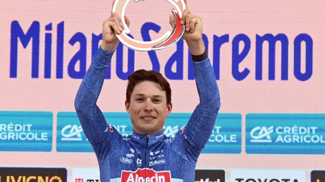 First PHILIPSEN Jasper (ALPECIN-DECEUNINCK) celebrates his victory on the podium after winning the men's elite race of the Milano -Sanremo one day cycling race (288km) from Pavia and to Sanremo - North West Italy- Saturday, March 16, 2024. Sport - cycling . (Photo by Gian Mattia D'Alberto/Lapresse)