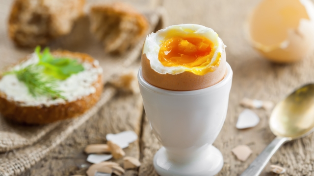 Perfect soft boiled egg with bread and butter for breakfast. Traditional healthy food.