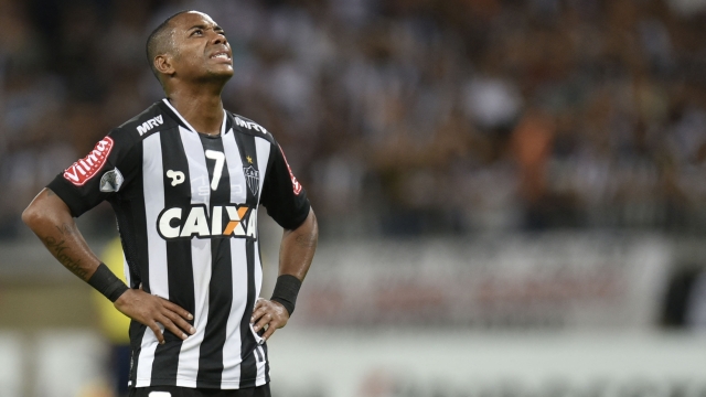 (FILES) Brazilian Atletico Mineiro player Robinho during their 2016 Libertadores Cup match at Mineirao Stadium in Belo Horizonte, Brazil on April 14, 2016. Former Manchester City and Real Madrid striker Robinho will serve a nine-year rape sentence, imposed on him by an Italian court, in Brazil, judges in Brasilia ruled on March 20, 2024. The court decided by nine votes to two in favor of an Italian request that Robinho be jailed in his home country after he was found guilty of taking part in the gang rape of an Albanian woman celebrating her 23rd birthday at a Milan nightclub in 2013. (Photo by DOUGLAS MAGNO / AFP)