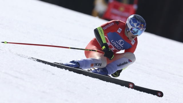 Switzerland's Marco Odermatt speeds down the course during an alpine ski, men's World Cup super-G race, in Saalbach, Austria, Friday, March 22, 2024. (AP Photo/Marco Trovati)