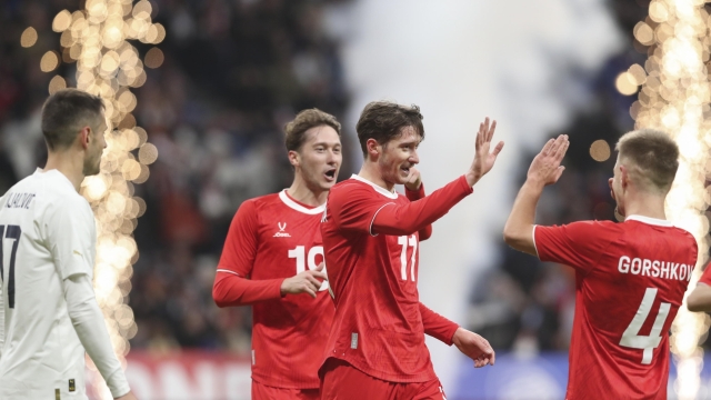 epa11234579 Yurii Gorshkov (R), Aleksei Miranchuk (C), and Anton Miranchuk (2nd-L) of Russia celebrate a goal during the international friendly soccer match between Russia and Serbia in Moscow, Russia, 21 March 2024.  EPA/MAXIM SHIPENKOV