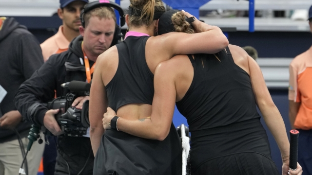 Aryna Sabalenka, right, of Belarus, embraces Paula Badosa, of Spain, after Sabalenka won their match at the Miami Open tennis tournament Friday, March 22, 2024, in Miami Gardens, Fla. (AP Photo/Lynne Sladky)